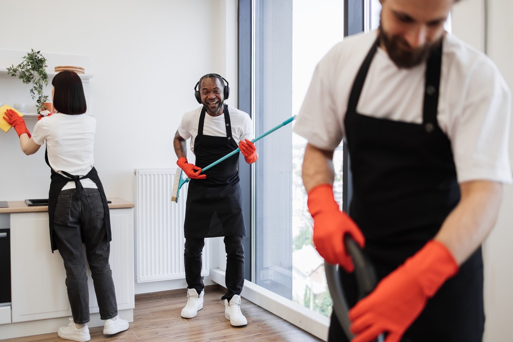 african-male-worker-washes-windows-having-fun-whi-2026-01-06-10-22-17-utc